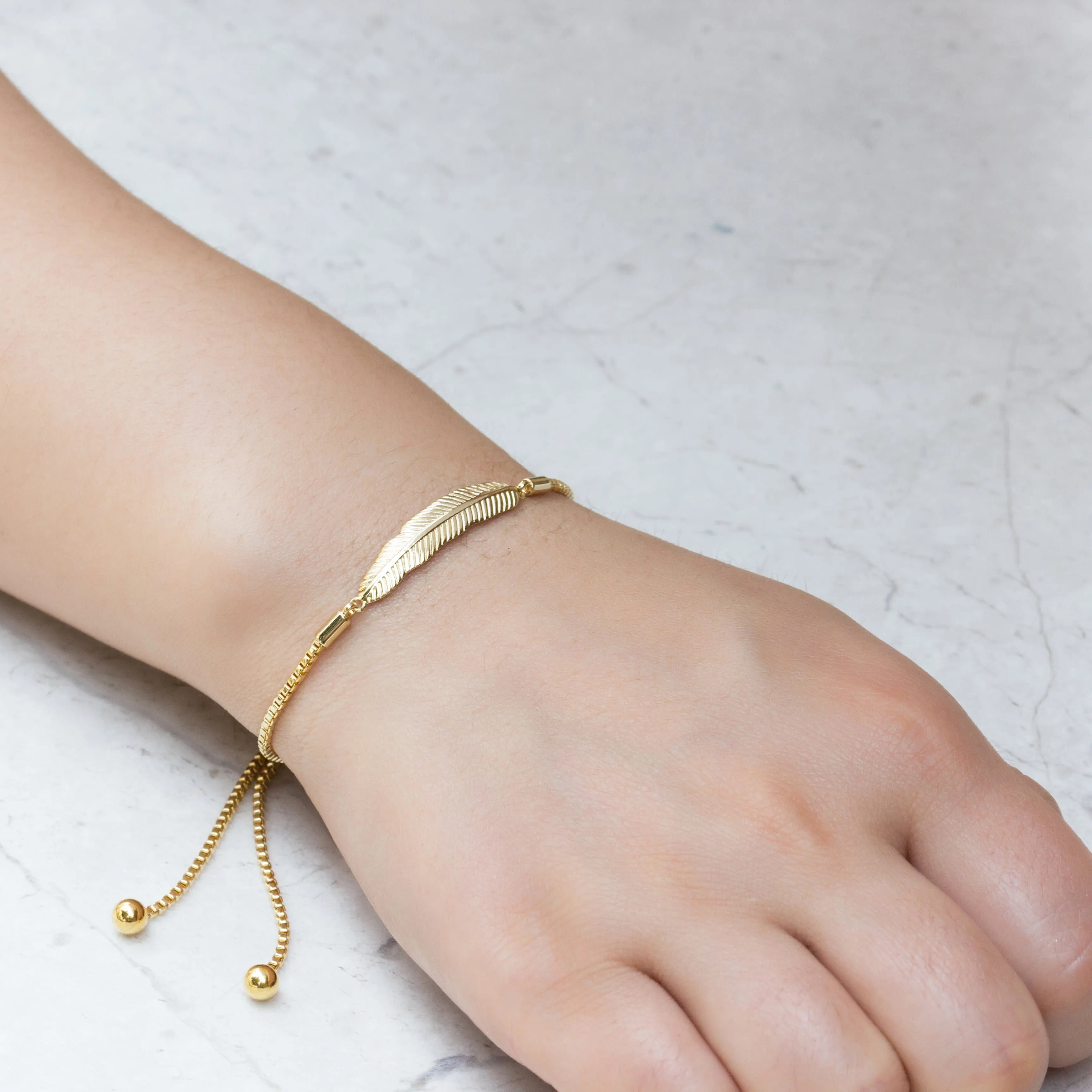 Gold Plated Feather Friendship Bracelet Created with Zircondia® Crystals