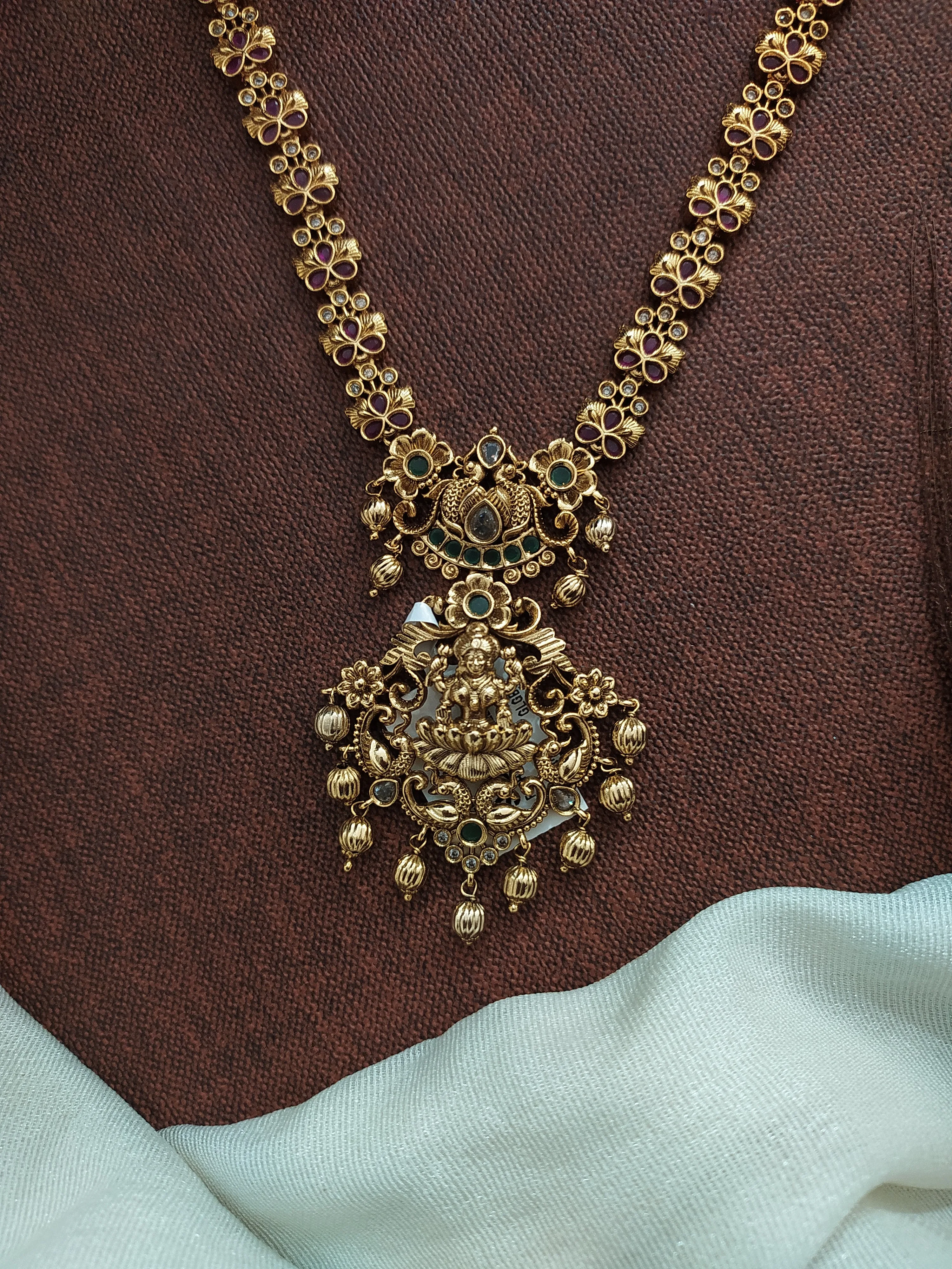 Simple Antique Floral Design Long Haram Set with Lakshmi Pendant & Matching Earrings